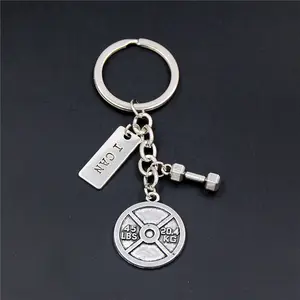 Dumbbell-shaped gym keychain with metal finish